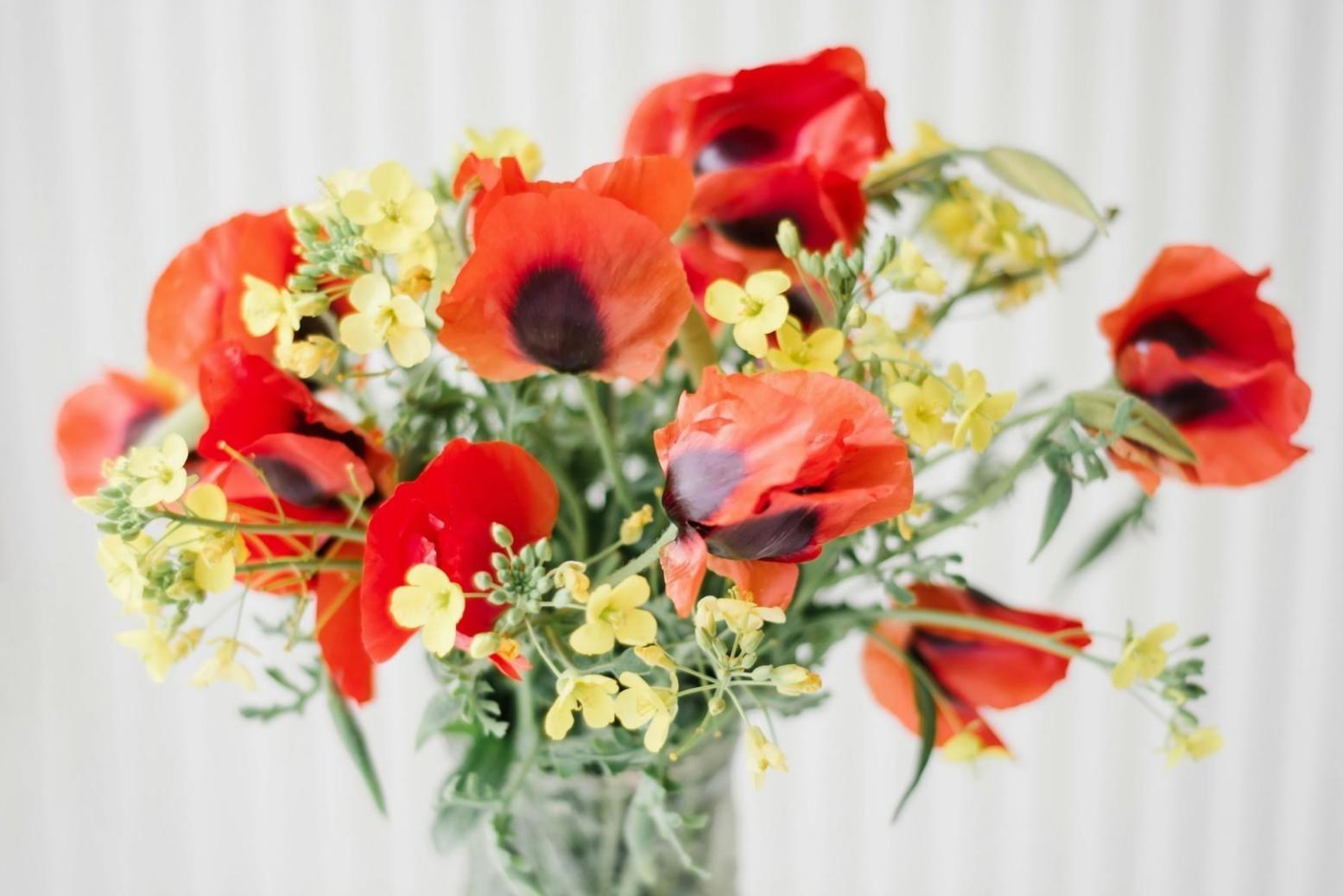 Flower arrangement workspace with fresh blooms and design tools